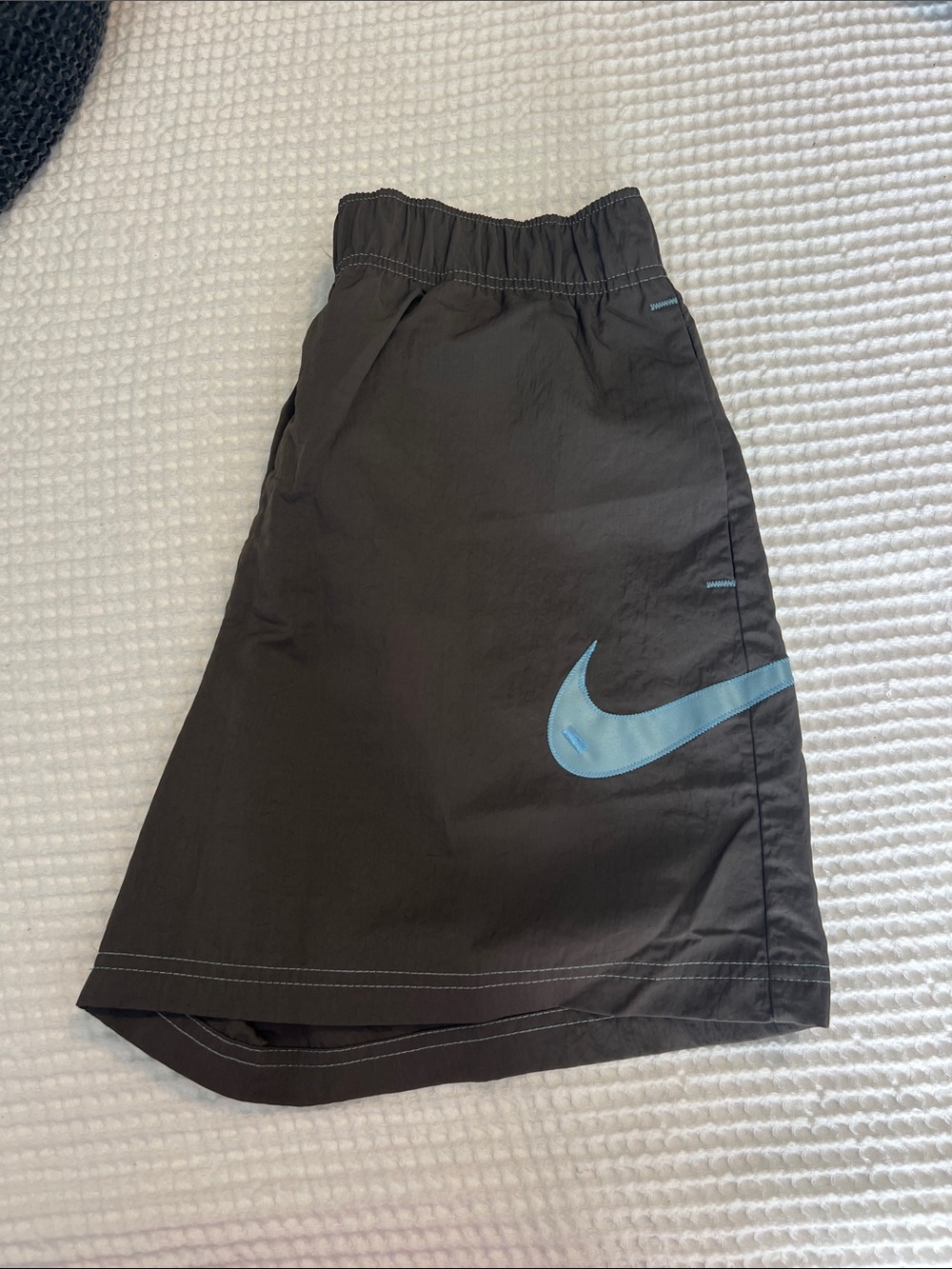 Nike Grey Athletic Shorts with Light Blue Swoosh